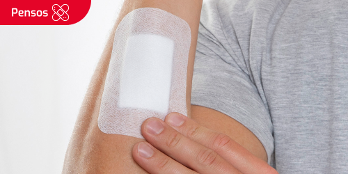 Uma pessoa com uma ligadura no braço Uma pessoa com uma ligadura no braço
